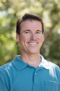 Photo of Pete Frezza outside under a tree in founders park 